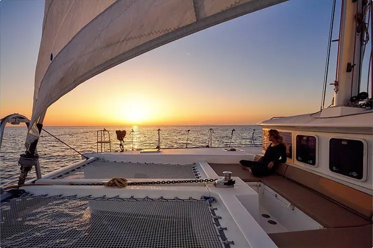 Sunset sailing catamaran cruise at Santorini volcano