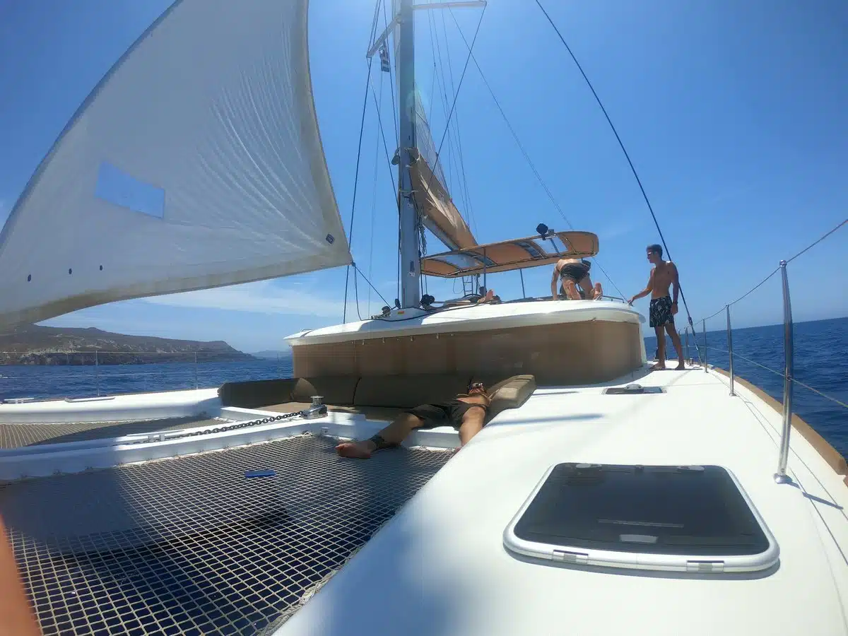 Front deck and trampoline net of a sailing catamaran in the Santorini caldera